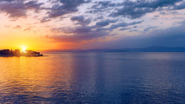 Beautiful sunset or sunrise above the sea. Tropical sunset or sunrise over sea. Colourful sunset or sunrise over water.