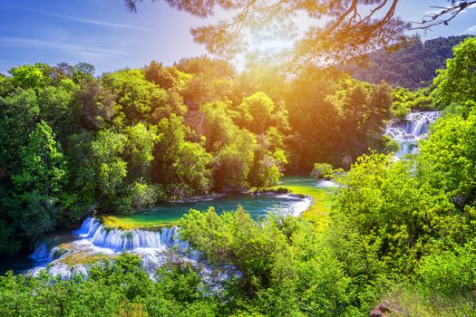 Waterfalls Krka, National Park, Dalmatia, Croatia. View of Krka National Park, Roski Slap location, Croatia, Europe. Beautiful world of Mediterranean countries. Traveling concept background.