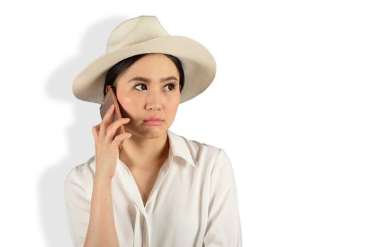 young attractive asian woman waiting answer for a smart phone on White backgroud 