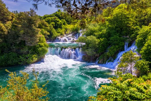Waterfalls Krka, National Park, Dalmatia, Croatia. View of Krka National Park, Roski Slap location, Croatia, Europe. Beautiful world of Mediterranean countries. Traveling concept background.