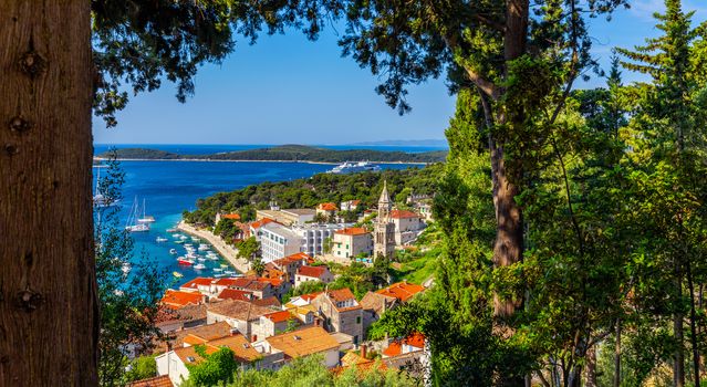 View at amazing archipelago in front of town Hvar, Croatia. Harbor of old Adriatic island town Hvar. Popular touristic destination of Croatia. Amazing Hvar city on Hvar island, Croatia.