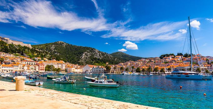 View at amazing archipelago with boats in front of town Hvar, Croatia. Harbor of old Adriatic island town Hvar. Popular touristic destination of Croatia. Amazing Hvar city on Hvar island, Croatia. 