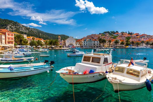 View at amazing archipelago with boats in front of town Hvar, Croatia. Harbor of old Adriatic island town Hvar. Popular touristic destination of Croatia. Amazing Hvar city on Hvar island, Croatia. 