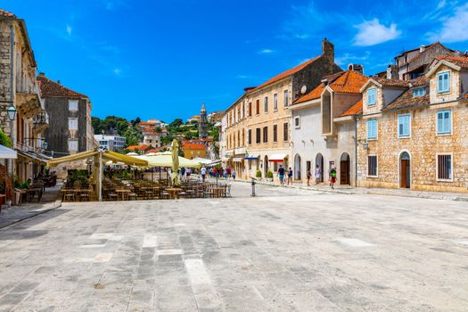 Main square in old medieval town Hvar. Hvar is one of most popular tourist destinations in Croatia in summer. Central Pjaca square of Hvar town, Dalmatia, Croatia. 