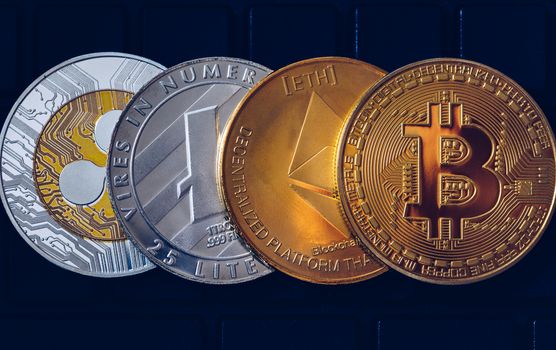 Set of cryptocurrencies with Bitcoin, Etherium, Ripple, Litecoin. Cryptocurrencys new digital money. Bitcoin on the front as the leader. Bitcoin as most important cryptocurrency.