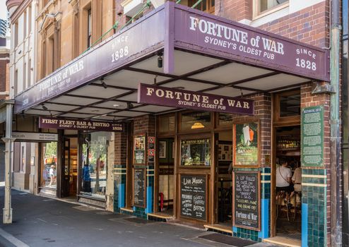 Sydney, Australia - February 11, 2019: Facade with look inside the Fortune of War, oldest pub in town in George Street near Circular Bay. Chalkboards with advertisements for drinks.
