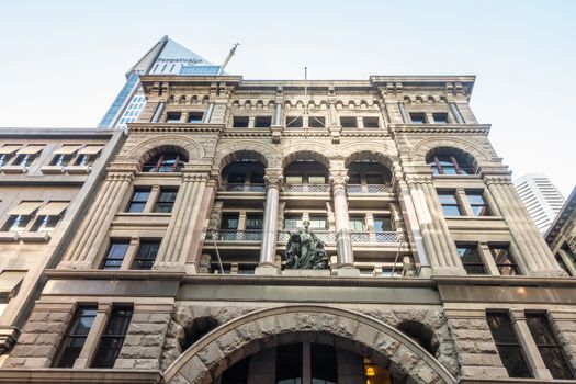 Sydney, Australia - February 12, 2019: Historic 330 George Street building with luxury shops such as High and Mighty, and Etoile Elite. Street scene early morning with people walking in street. The Royal George Bar.