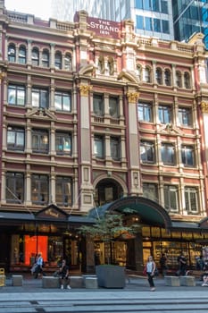 Sydney, Australia - February 12, 2019: Historic and Iconic The Strand Building in George Street. Luxury shops and people in the street.
