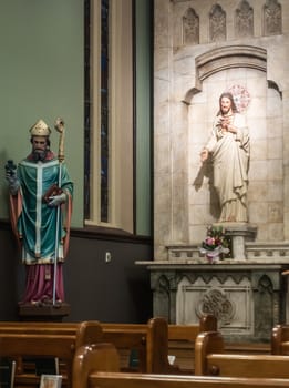 Sydney, Australia - February 12, 2019: Inside Saint Patricks Church on Grosvenor Street opposite of Lang Park. Saint Patrick and Sacred Heart statues.