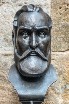 Sydney, Australia - February 12, 2019: Inside Saint Patricks Church on Grosvenor Street opposite of Lang Park. Closeup of bonze Charles O Neill statue at courtyard.