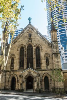 Sydney, Australia - February 12, 2019: Saint Patricks Church on Grosvenor Street opposite of Lang Park. Street view of front facade and entrances.