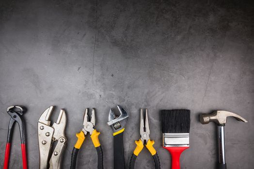 Home Repair Hand Tools on a cement gray background. Concept home repair, Home improvement, Renovate home.Construction Tools Concept