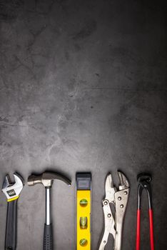 Home Repair Hand Tools on a cement gray background. Concept home repair, Home improvement, Renovate home.Construction Tools Concept