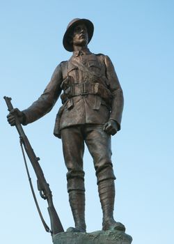 Statue of a WWI soldier in Winchester - Kings Royal Rifle Corps Memorial.
Bronze statue in Cathedral Close, Winchester, hampshire, UK by John Tweed (1869-1933). Created in 1922.