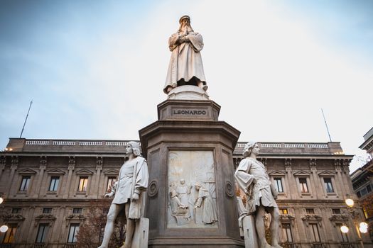 Milan, Italy - November 2, 2017: Architectural detail of a statue to the glory of Leonardo da Vinci by sculptor Pietro Magni in 1872 in front of Milan City Hall