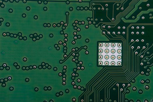 Electronic circuit board close up. Selective focus and crop fragment