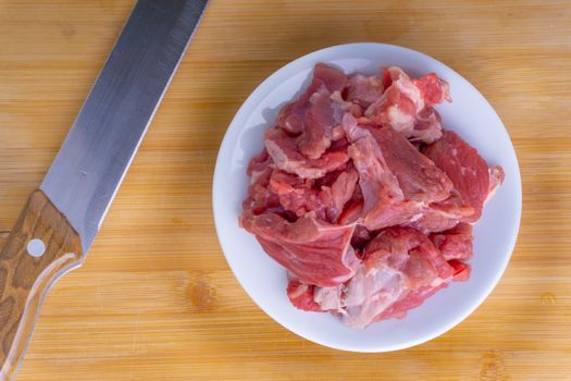Fresh raw beef steak on wooden background with selective focus