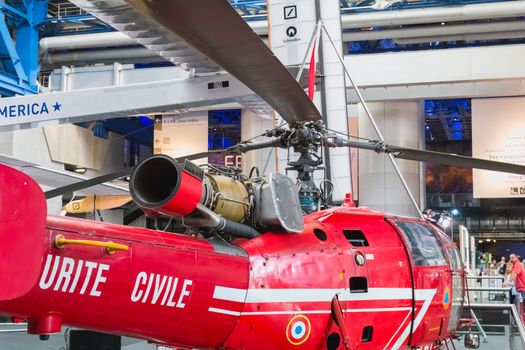 Paris, France - October 6, 2018 - Old Red Helicopter of Civil Security exhibited at the entrance of the City of Science and Industry during the Science Festival