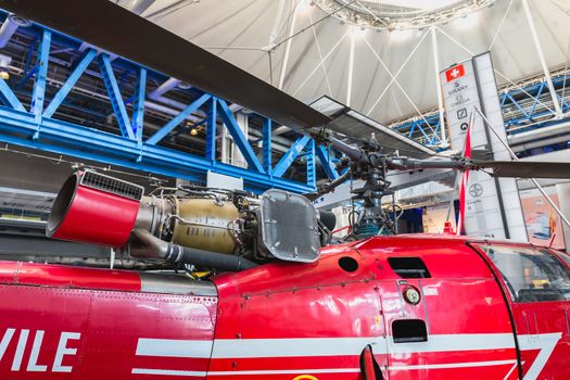 Paris, France - October 6, 2018 - Old Red Helicopter of Civil Security exhibited at the entrance of the City of Science and Industry during the Science Festival