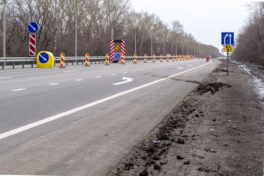 Beware, detour, repair of the road. Change lanes. Speed limit