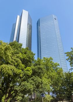 FRANKFURT AM MAIN, GERMANY - JULY 2, 2015: Skyscrapers of Frankfurt am Main. Frankfurt is the fifth-largest city in Germany.

Frankfurt am Main, Germany - July 2, 2015: Skyscrapers of Frankfurt am Main. Frankfurt is the fifth-largest city in Germany.