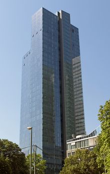 FRANKFURT AM MAIN, GERMANY - JULY 2, 2015: Skyscraper of Frankfurt am Main. Frankfurt is the fifth-largest city in Germany.

Frankfurt am Main, Germany - July 2, 2015: Skyscraper of Frankfurt am Main. Frankfurt is the fifth-largest city in Germany.