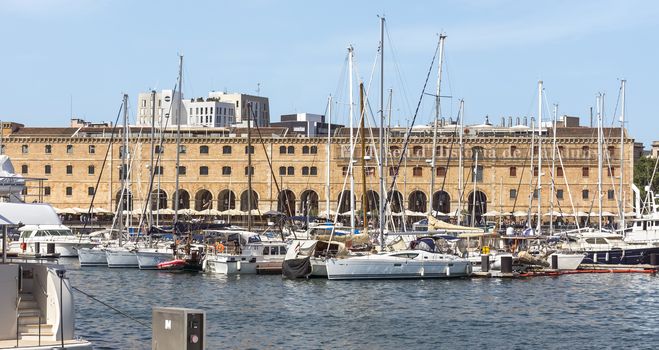 BARCELONA, SPAIN - JULY 4, 2015: The building "Palau de Mar" (1880-1890) home of museum "Museu d'Historia de Catalunya" in front of the harbor.

Barcelona, Spain - July 4, 2015: The building "Palau de Mar" (1880-1890) home of museum "Museu d'Historia de Catalunya" in front of the harbor.