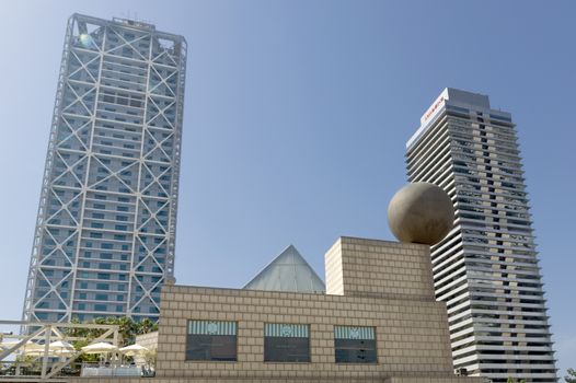 BARCELONA, SPAIN - JULY 4, 2015: Hotel Arts, built by SOM Group, and Tower Mapfre, build by Ortiz-De Leon, both in 1992 in Barcelona, Spain.

Barcelona, Spain - July 4, 2015: Hotel Arts, built by SOM Group, and Tower Mapfre, build by Ortiz-De Leon, both in 1992 in Barcelona, Spain.