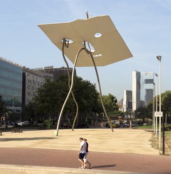 BARCELONA, SPAIN - JULY 6, 2015: View of the statue dedicated to Volunteer of the Olympic Summer games of Barcelona in 1992. Of unknown author, this work of art, erected in 1992.

Barcelona, Spain - July 6, 2015: View of the statue dedicated to Volunteer of the Olympic Summer games of Barcelona in 1992. Of unknown author, this work of art, erected in 1992. People are walking by street.