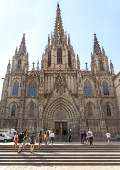 BARCELONA, SPAIN - JULY 6, 2015: Cathedral of the Holy Cross and Saint Eulalia, Barri Gothic Quarter, Barcelona, Catalonia.

Barcelona, Spain - July 6, 2015: Barcelona's gothic Cathedral, known as La Seu, located in the heart of the Gothic Quarter. People come to the Cathedral.