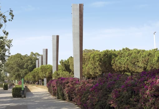 BARCELONA, SPAIN - JULY 4, 2015: Promenade at Poblenou district in Barcelona, Spain on sunny day.

Barcelona, Spain - July 4, 2015: Promenade at Poblenou district in Barcelona, Spain on sunny day. People are walking by promenade.