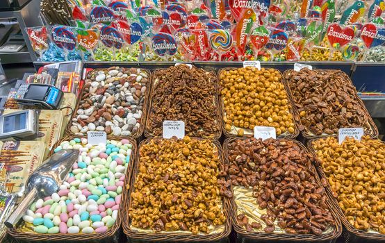 BARCELONA, SPAIN - JULY 6, 2015: Nuts and almonds for sale at the Mercat de Sant Josep de la Boqueria in Barcelona. It is a large public market in the Ciutat Vella district of Barcelona.

Barcelona, Spain - July 6, 2015: Nuts and almonds for sale at the Mercat de Sant Josep de la Boqueria in Barcelona. It is a large public market in the Ciutat Vella district of Barcelona.