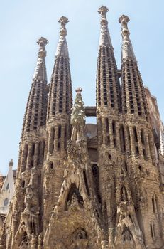 BARCELONA, SPAIN - JULY 6, 2015: La Sagrada Familia - the impressive cathedral designed by Gaudi, which is being build since 19 March 1882 and is not finished yet.