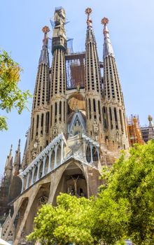 BARCELONA, SPAIN - JULY 6, 2015: La Sagrada Familia - the impressive cathedral designed by Gaudi, which is being build since 19 March 1882 and is not finished yet.

Barcelona, Spain - July 6, 2015: La Sagrada Familia - the impressive cathedral designed by Gaudi, which is being build since 19 March 1882 and is not finished yet.