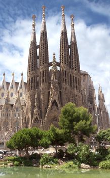 BARCELONA, SPAIN - JULY 6, 2015: La Sagrada Familia - the impressive cathedral designed by Gaudi, which is being build since 19 March 1882 and is not finished yet.

Barcelona, Spain - July 6, 2015: La Sagrada Familia - the impressive cathedral designed by Gaudi, which is being build since 19 March 1882 and is not finished yet.