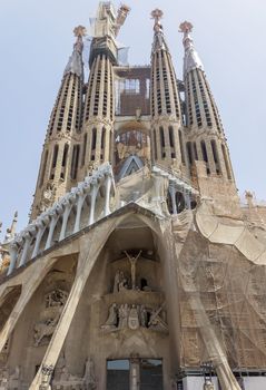 BARCELONA, SPAIN - JULY 6, 2015: La Sagrada Familia - the impressive cathedral designed by Gaudi, which is being build since 19 March 1882 and is not finished yet.

Barcelona, Spain - July 6, 2015: La Sagrada Familia - the impressive cathedral designed by Gaudi, which is being build since 19 March 1882 and is not finished yet.
