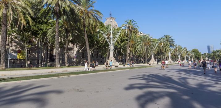 BARCELONA, SPAIN - JULY 8, 2015: Promenade leading to the Parc de la Ciutadella in Barcelona.

Barcelona, Spain - July 8, 2015: Promenade leading to the Parc de la Ciutadella in Barcelona. People are walking by promenade.