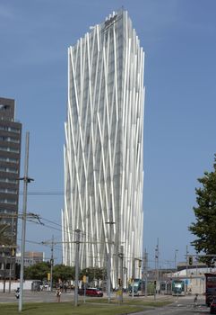 BARCELONA, SPAIN - JULY 7, 2015: New modern architecture in the Diagonal Mar i el Front Maritim del Poblenou area.

Barcelona, Spain - July 7, 2015: New modern architecture in the Diagonal Mar i el Front Maritim del Poblenou area. This is a new booming area with modern buildings. Diagonal Mar - District, built at the end of the past - the beginning of this century. The impetus for its development was the holding in the capital of Catalonia, the World Cultural Forum. Diagonal Mar is famous for its clean and tranquil beaches, upscale apartments and hotels. People are walking by street.