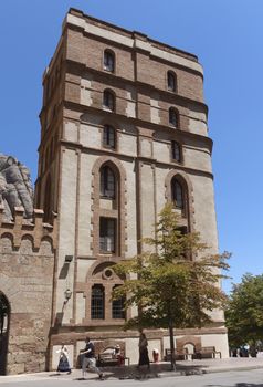 BARCELONA, SPAIN - JULY 10, 2015: The Benedictine abbey Santa Maria de Montserrat in Monistrol de Montserrat, Spain. It hosts the Virgin of Montserrat, the favourite in Catalonia.

Barcelona, Spain - July 10, 2015: The Benedictine abbey Santa Maria de Montserrat in Monistrol de Montserrat. It hosts the Virgin of Montserrat, the favourite in Catalonia. Montserrat Monastery located high up in the mountains near Barcelona, Spain. People are visiting the Monastery.