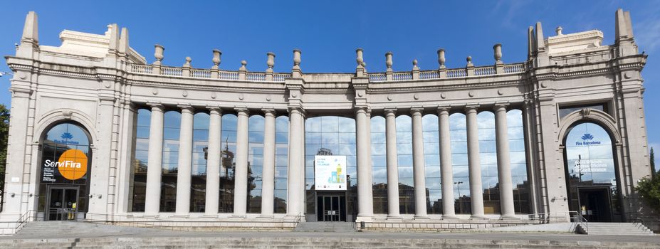 BARCELONA, SPAIN - JULY 8, 2015: Fira Barcelona - a trade show and exhibition center in Barcelona, Spain. It was built in 1929 to International Exposition.

Barcelona, Spain - July 8, 2015: Fira Barcelona - a trade show and exhibition center in Barcelona, Spain. It was built in 1929 to International Exposition.