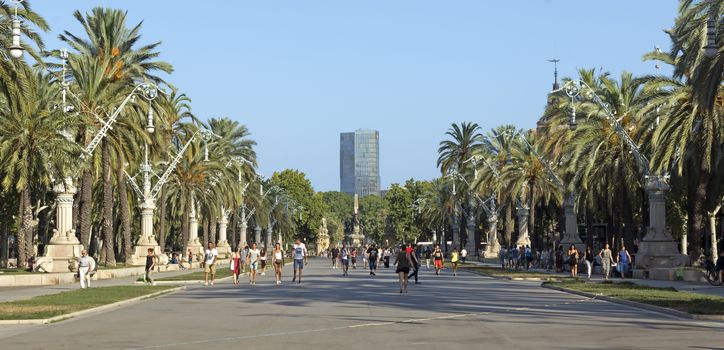 BARCELONA, SPAIN - JULY 8, 2015: Promenade leading to the Parc de la Ciutadella in Barcelona.

Barcelona, Spain - July 8, 2015: Promenade leading to the Parc de la Ciutadella in Barcelona. People are walking by promenade.