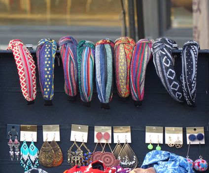 KAOHSIUNG, TAIWAN -- DECEMBER 14, 2019: A street vendor sells hairbands and jewelry with local indigenous tribal designs.
