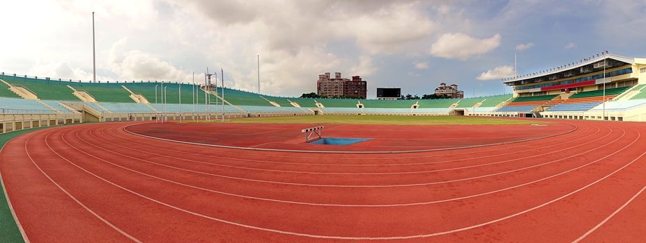 KAOHSIUNG, TAIWAN -- JULY 1, 2014: A view of the athletic running tracks and the bleachers of the Jhong Jheng Stadium in Kaohsiung city.