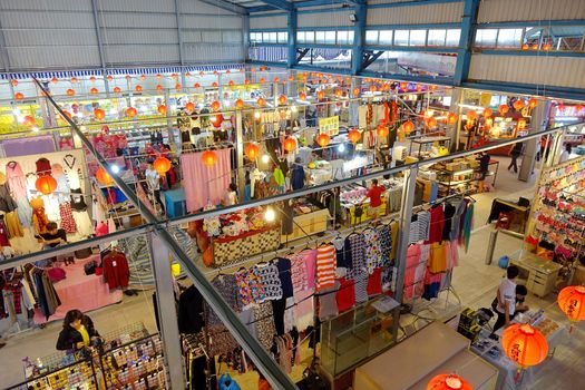 KAOHSIUNG, TAIWAN -- NOVEMBER 20, 2015: Vendors sell clothes and fashion accessories at the newly opened Jiangguo Outdoor Market.
