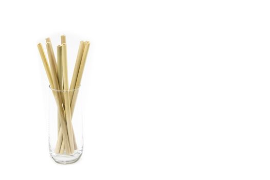 Eco-friendly Bamboo drinking straws against white background and large copy space (no to plastic concept)