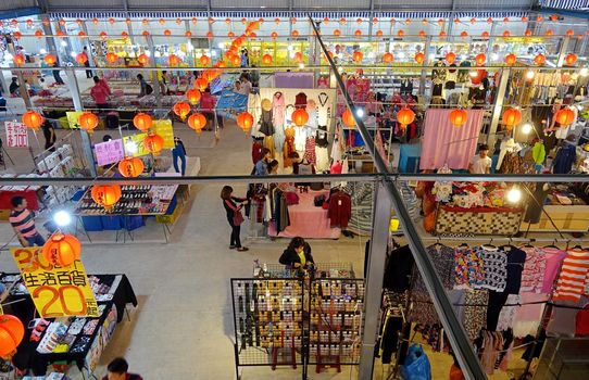 KAOHSIUNG, TAIWAN -- NOVEMBER 20, 2015: Vendors sell clothes and fashion accessories at the newly opened Jiangguo Outdoor Market.