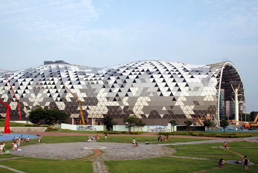 KAOHSIUNG, TAIWAN - JUNE 30: Construction continues on the new Kaohsiung Exhibition and Convention Center, scheduled to open in early 2014, on June 30, 2013 in Kaohsiung