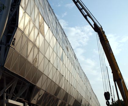 KAOHSIUNG, TAIWAN - JUNE 30: Construction continues on the new Kaohsiung Exhibition and Convention Center, scheduled to open in early 2014, on June 30, 2013 in Kaohsiung