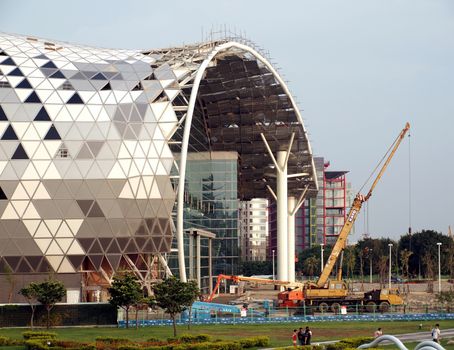 KAOHSIUNG, TAIWAN - JUNE 30: Construction continues on the new Kaohsiung Exhibition and Convention Center, scheduled to open in early 2014, on June 30, 2013 in Kaohsiung