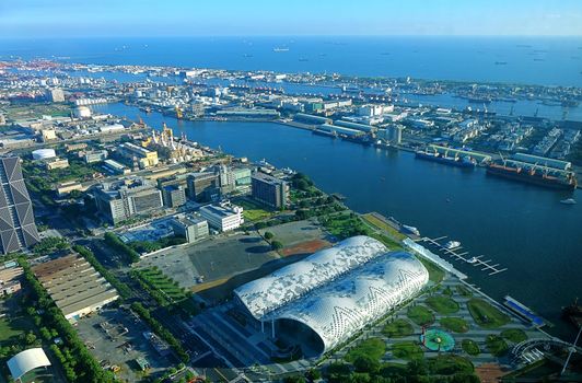 KAOHSIUNG, TAIWAN -- JULY 13, 2014:  An aerial view of Kaohsiung Port with the new Exhibition Center in the foreground.